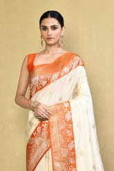 Off - White And Orange Banarasi Handloom Saree With Blouse
