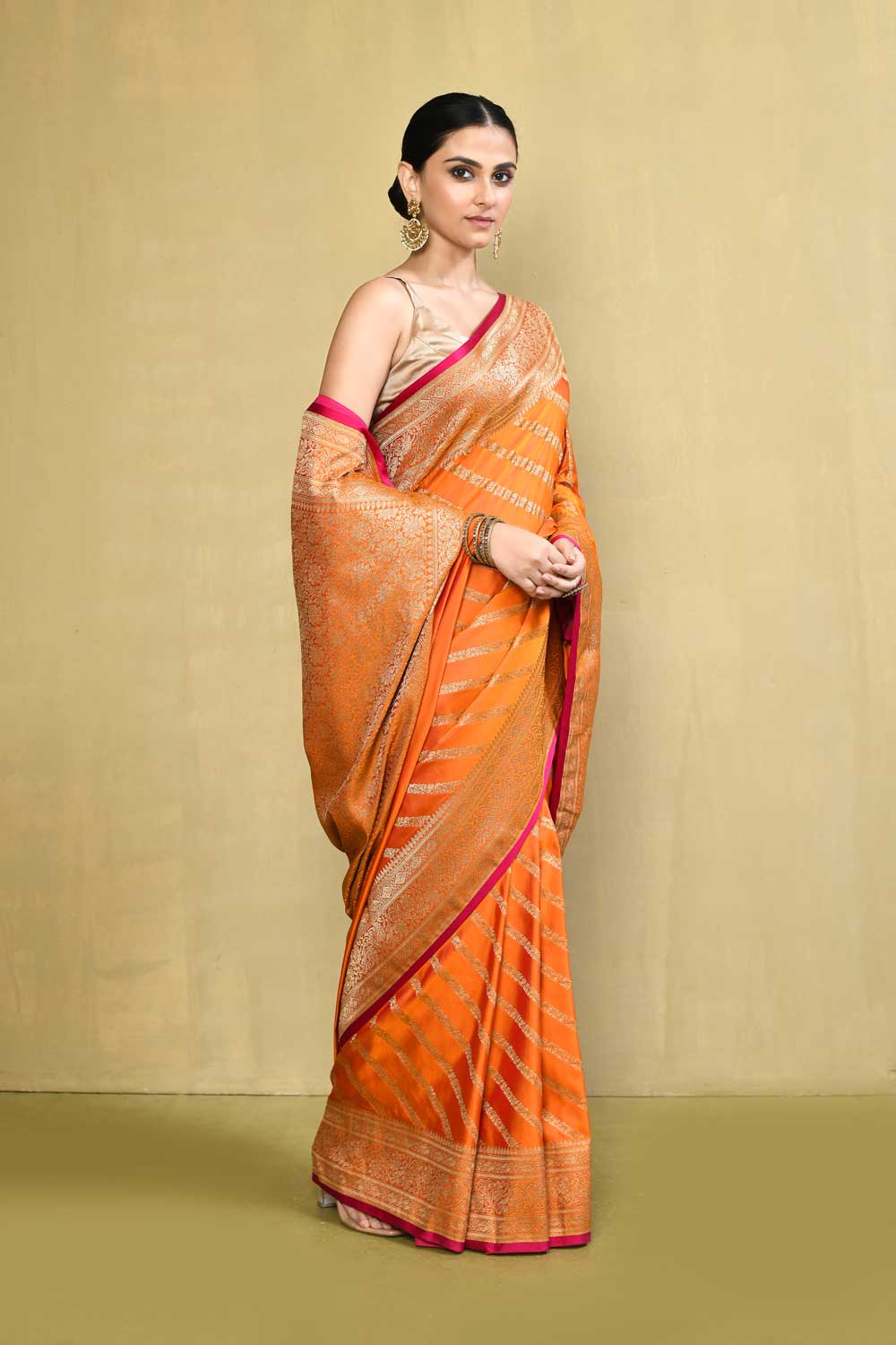 Orange Banarasi Handloom Saree With contemporary adda stripe pattern Design Orange Banarasi Handloom Saree With contemporary adda stripe pattern Design