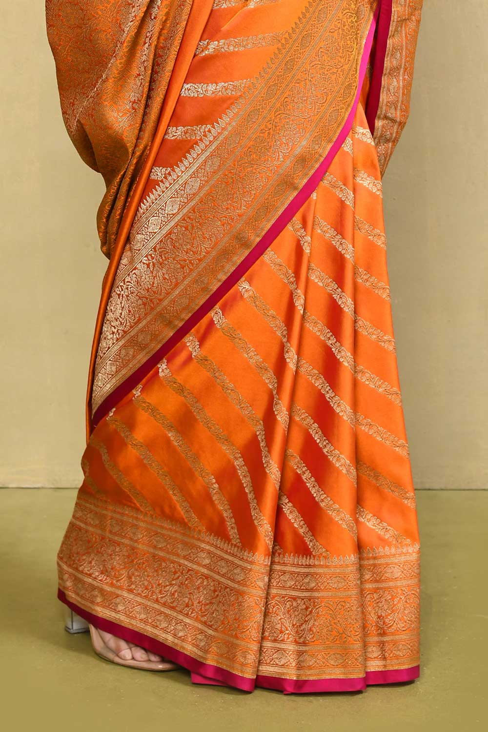Orange Banarasi Handloom Saree With contemporary adda stripe pattern Design Orange Banarasi Handloom Saree With contemporary adda stripe pattern Design