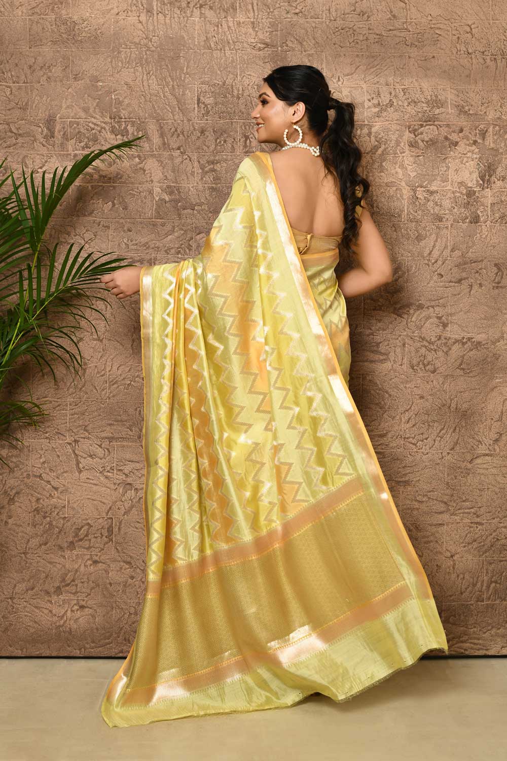 Rangkat Pure Katan Chiniya Silk Banarasi Handloom Saree With Floral Border in lemon yellow Rangkat Pure Katan Chiniya Silk Banarasi Handloom Saree With Floral Border in lemon yellow