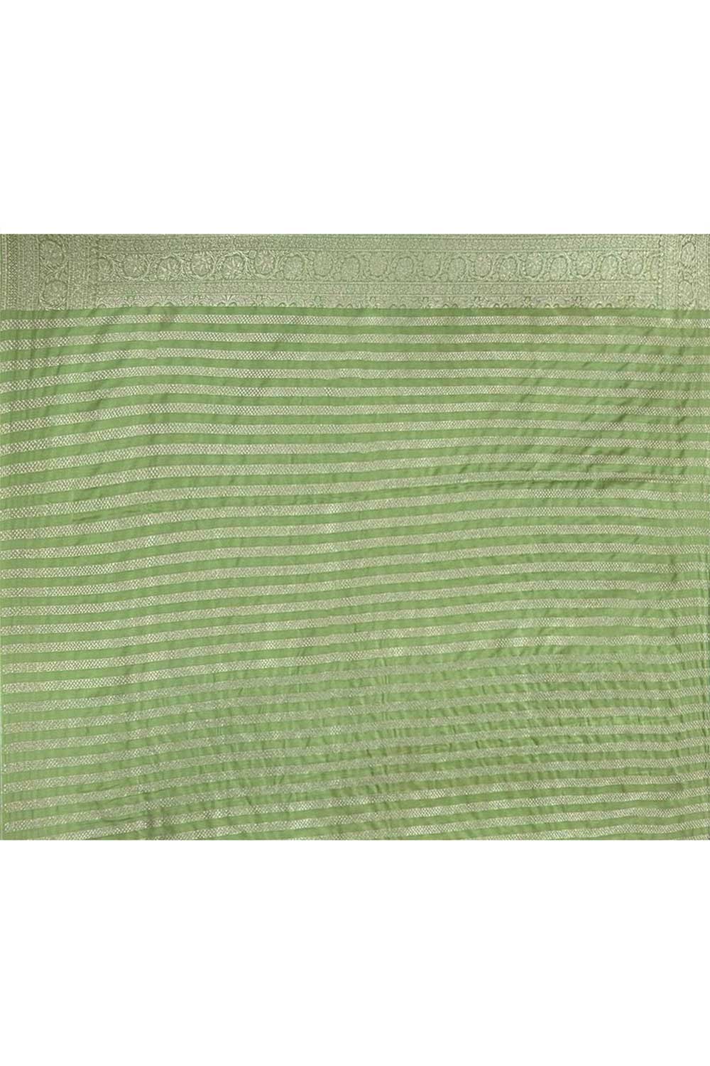 Pastel Green Mushru Satin Banarasi Handloom Saree With All Over Jaal In Silver Zari Pastel Green Mushru Satin Banarasi Handloom Saree With All Over Jaal In Silver Zari