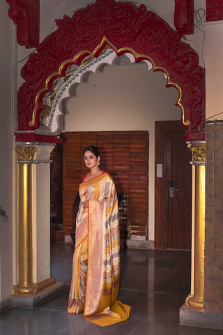 Rangkat Pure Tussar Georgette Banarasi handloom silk saree with stripe-patterned body and Meenakari border